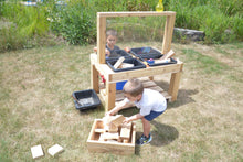 Load image into Gallery viewer, Two young boys on either side of a wooden 4-bin social distancing sensory table. Box of blocks featured but not included.