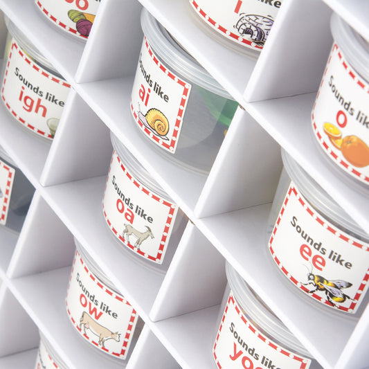 A variety of spelling and phonics tubs such as sounds like "EE" or "O ."
