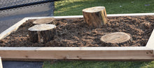 Load image into Gallery viewer, Set of four stumps variing in height in a bed os mulch 
